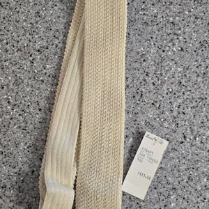 Vintage Marshall Field & Co. men's slim beige knit necktie with a square end